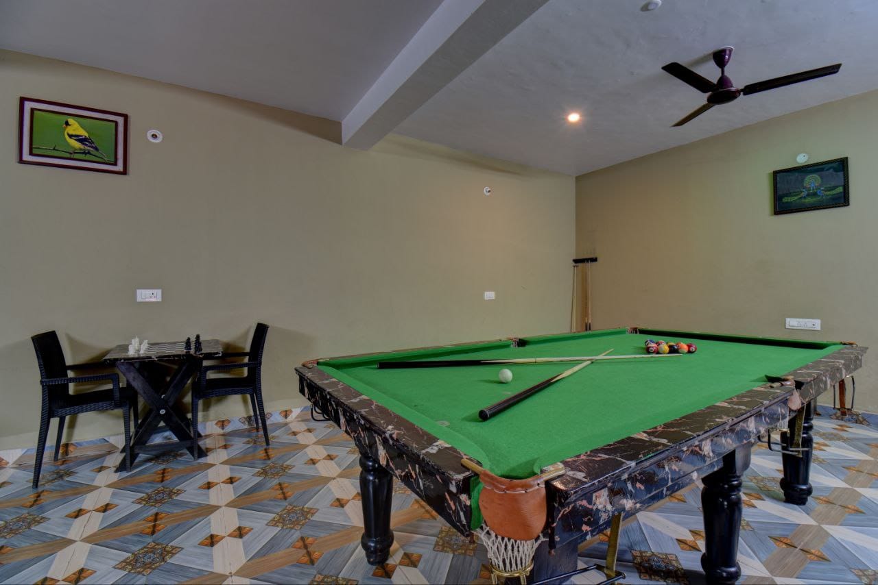 Recreation zone with secondary view of billiards table setup